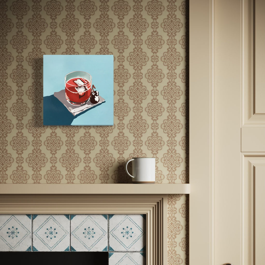 The artwork 'Cherry Cocktail' by Lori Larusso depicts a vibrant red cocktail in a crystal glass against a light blue background, painted in a bold, minimalist pop art style. The composition features sharp shadows and clean lines executed in acrylic and enamel on a 10x10 inch wood panel, showcasing contemporary realism with graphic elements.