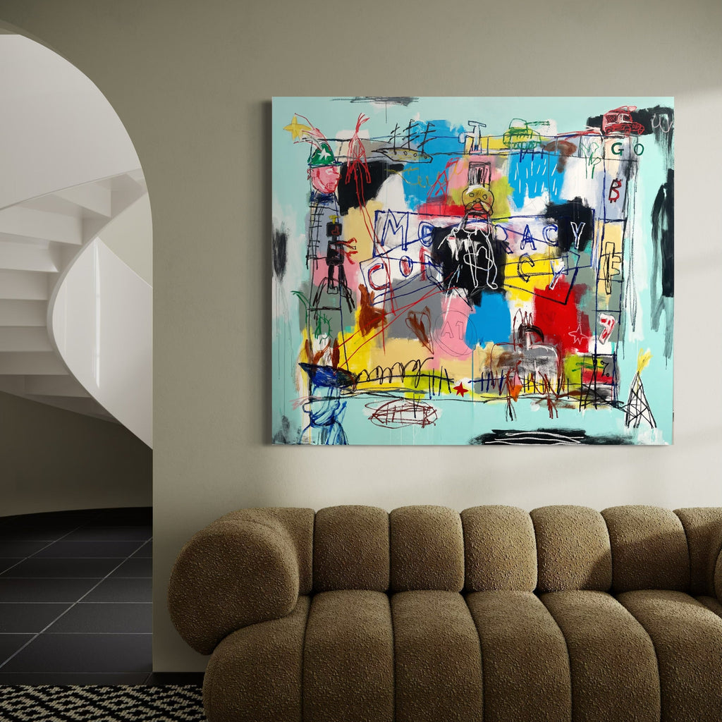 The artwork 'Conspiracy the Game' by Andrew Chan features a vibrant abstract composition with graffiti-style elements. Bold splashes of turquoise, red, yellow, and pink intermingle with black gestural lines and sketchy figures. The chaotic yet balanced arrangement includes geometric shapes, spontaneous scribbles, and text-like marks against a light blue background, creating a neo-expressionist street art aesthetic on canvas.