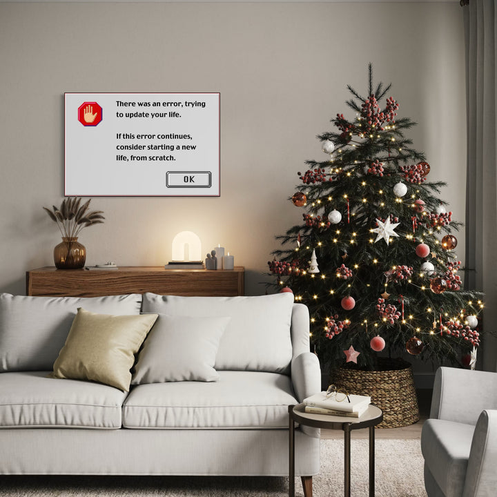 ERROR by Harold Herb depicts a digital error message with a red hand icon and a message about starting a new life. It hangs on a neutral wall above a wooden sideboard in a cozy living room featuring a white sofa adorned with cushions and a warmly lit Christmas tree with red and white decorations.