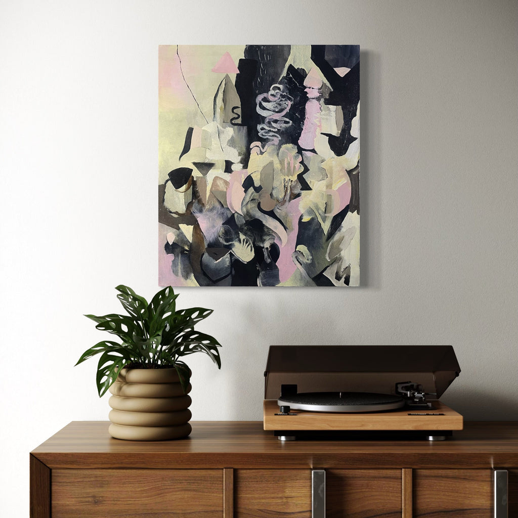 The artwork, Excavation Spires, by David Louis Cintron, displayed in a room.