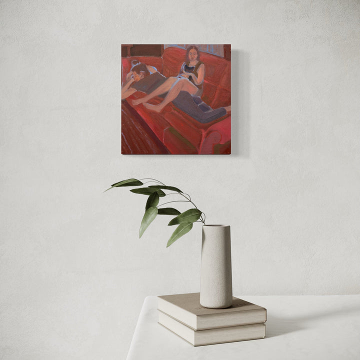 The artwork, God gave us pleasure [roommates and our cat], by Chelsie Sunde, displayed in a room.