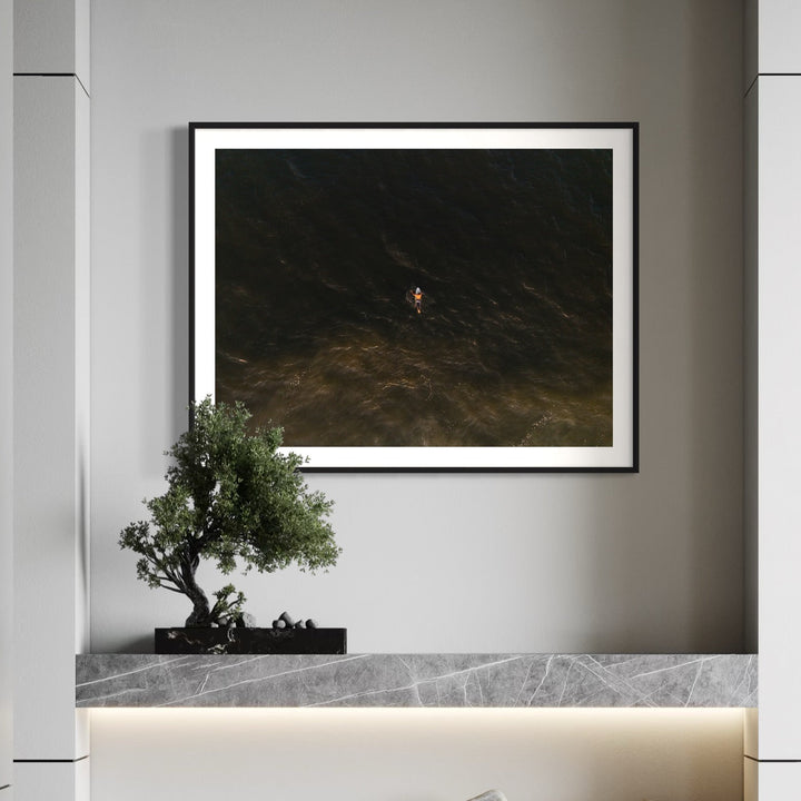 The artwork, Golden Hour Drift, by Dennis Maida, displayed in a room.