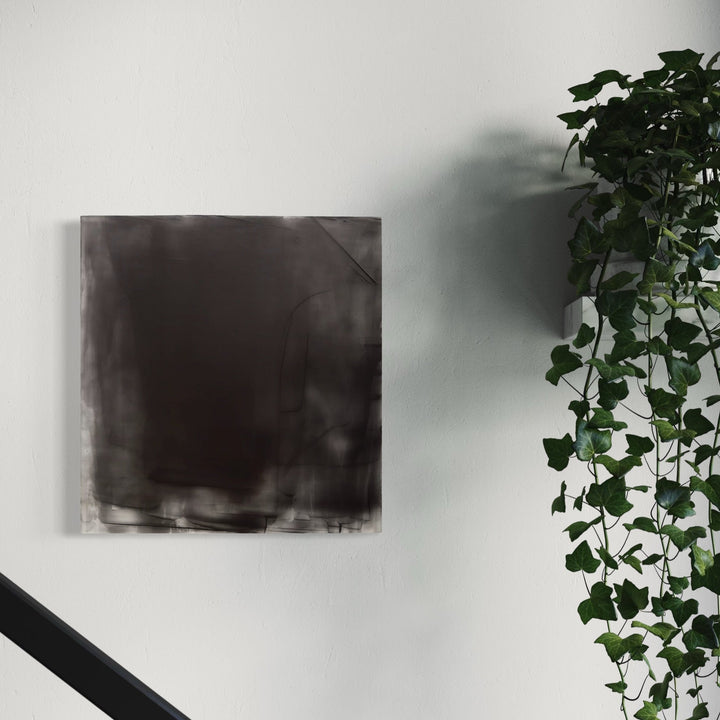 The artwork, Graphite Veil 7, by Debra Ramsay, displayed in a room.