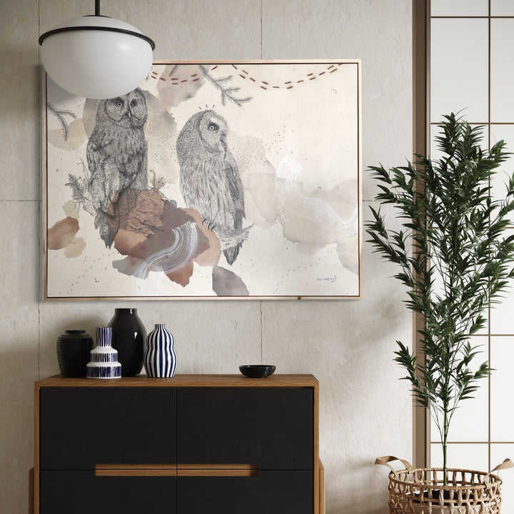 The artwork, Great Gray Owl, Magisterial Giant of the North, by Alicia Hauff, displayed in a room.