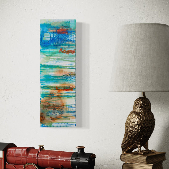 The artwork 'Green Ribbons 2' by Lisa Petker Mintz features vibrant layered brushstrokes of turquoise, aqua, and coral orange creating a vertical abstract seascape. The 18x6 inch acrylic painting displays fluid, ribbon-like patterns with textural elements and dynamic horizontal striations, suggesting movement and oceanic depth on canvas - by Lisa Petker Mintz