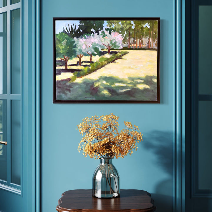 The artwork, Gutierrz-Hubbell House Orchard, by Connie Falk, displayed in a room.