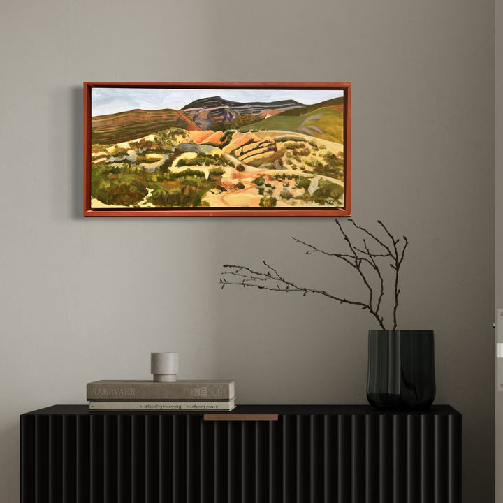 The artwork, Honey Mountains 1, by Connie Falk, displayed in a room.