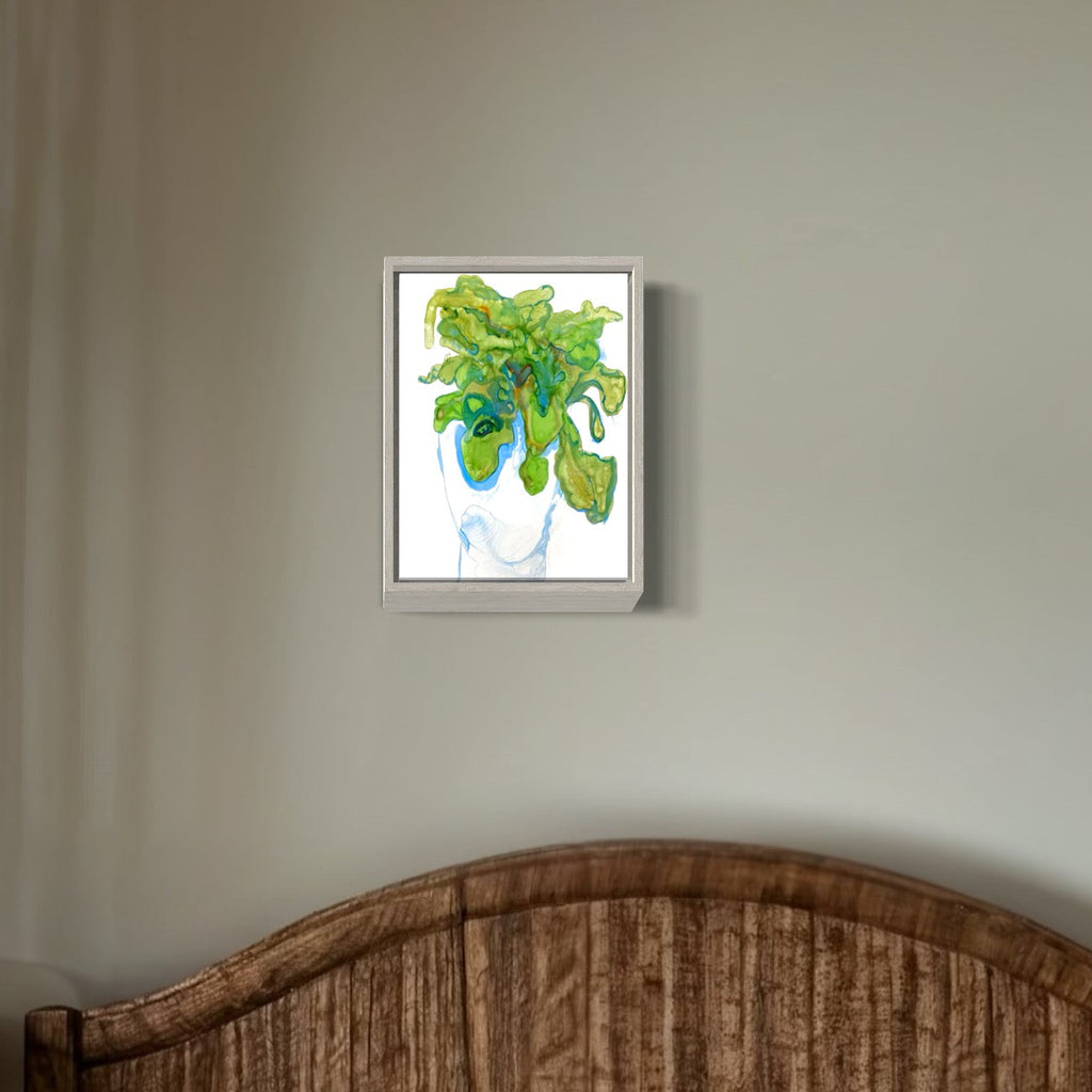 The artwork 'Lamb's Ear' by Monica Carrier features vibrant green botanical forms with flowing, organic shapes rendered in archival ink. The abstract composition shows curling, leaf-like elements in various shades of spring green and turquoise, set against a crisp white background in a sleek silver frame, creating a fresh and dynamic botanical study.
