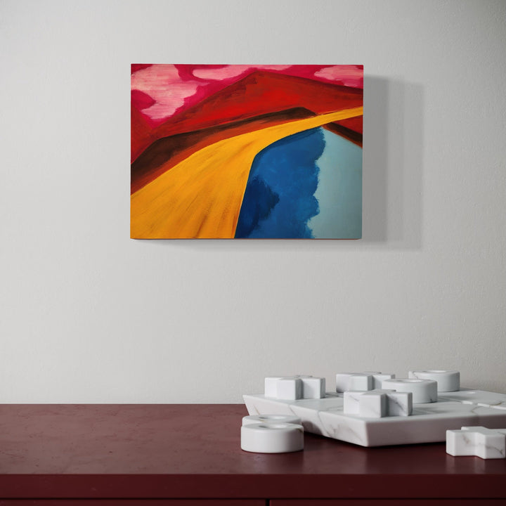 The artwork, Let's Go, by Joanie Flickinger, displayed in a room.