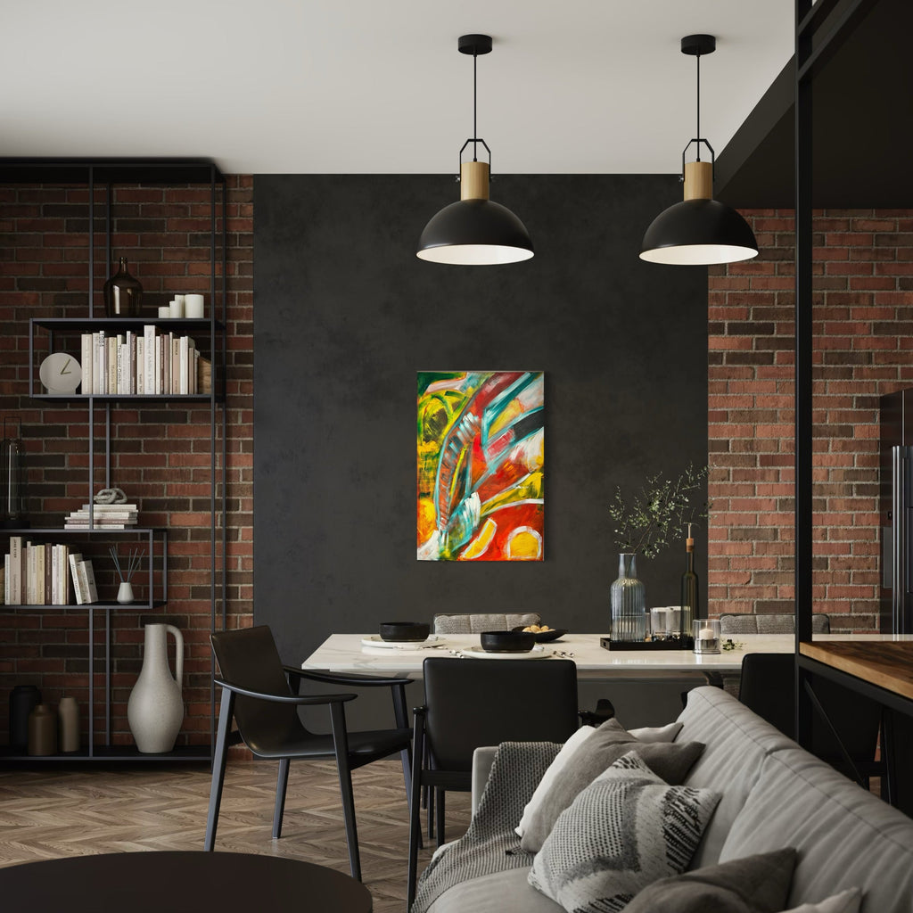 The artwork 'Manifestation' by Genevieve Antonello features vibrant abstract swirls of yellow, red, and turquoise against an energetic background. Dynamic brushstrokes and bold color transitions create a sense of movement and emotional depth in this oil painting on board, displayed in a modern interior setting. Original art piece by Genevieve Antonello.
