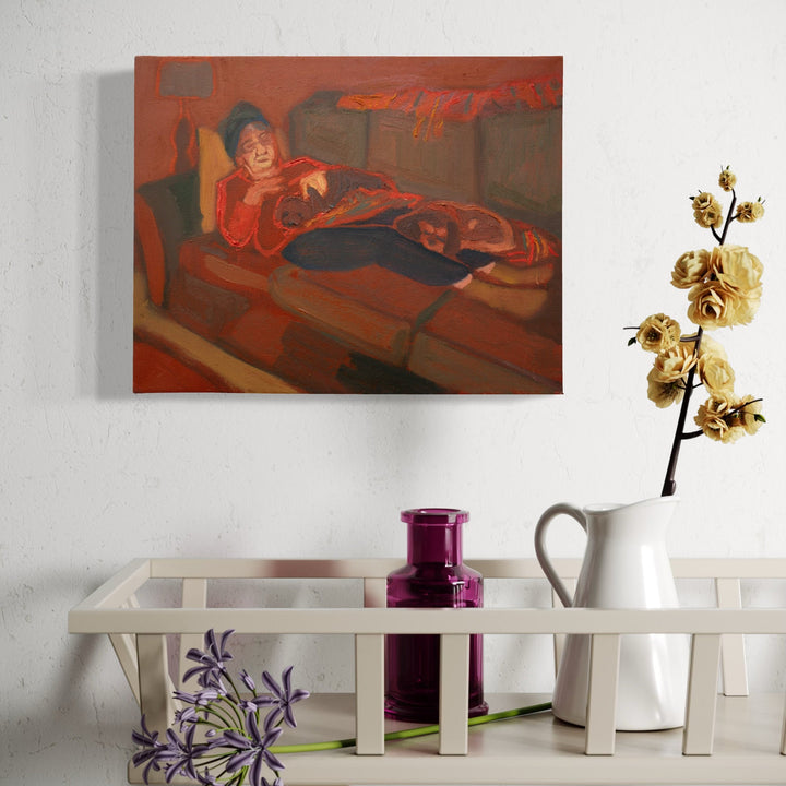 The artwork, Midnight ode to the TV [grandma Jenny with her dogs], by Chelsie Sunde, displayed in a room.