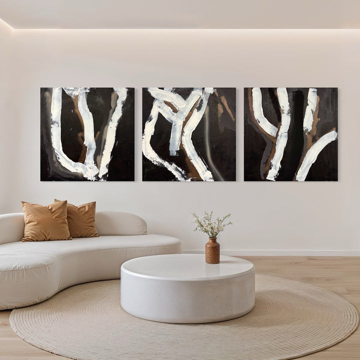 The artwork, Moody Fall 12 Triptych, by Albion Vu, displayed in a room.