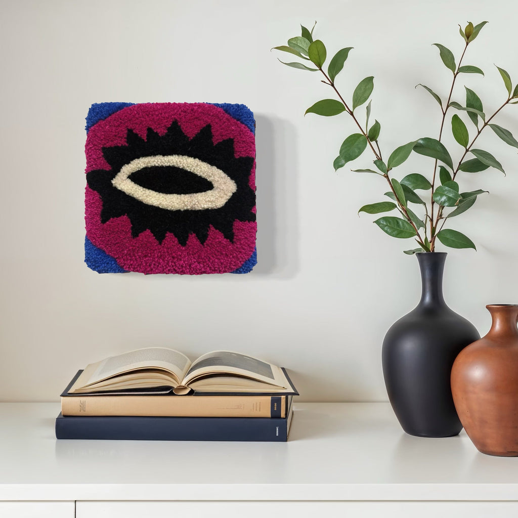 The artwork, Olho, by Ana Maria Farina, displayed in a room.