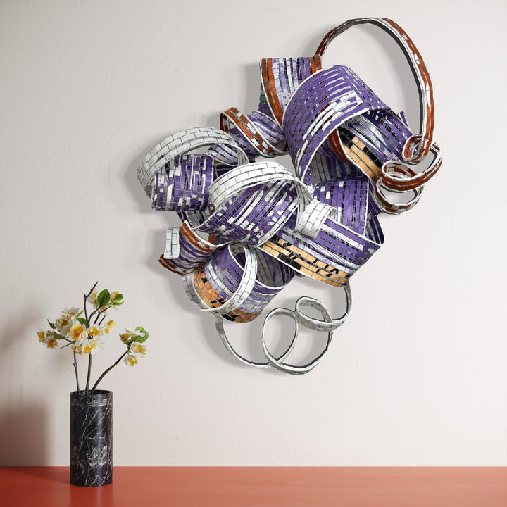 The artwork, Ouroboros, by Shelley Heffler, displayed in a room.