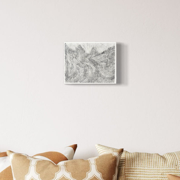 A photo of the artwork Over Under 2, by Zoe Cohen, hanging on a wall.