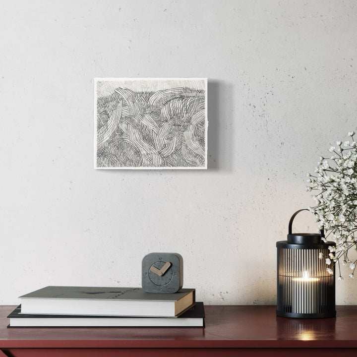 A photo of the artwork Over Under 3, by Zoe Cohen, hanging on a wall.