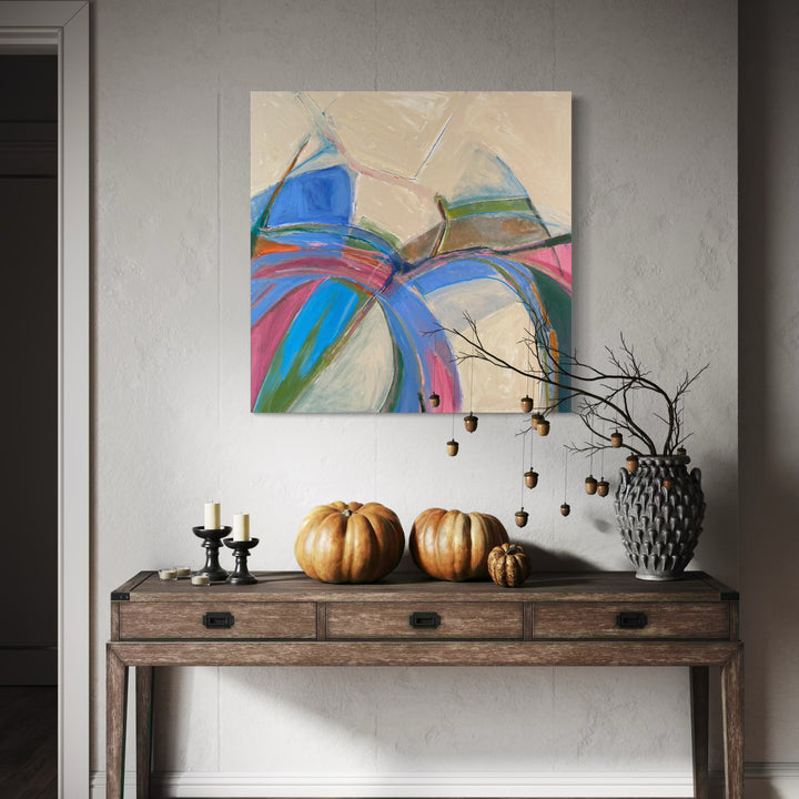 The artwork 'Periwinkle' by Beth Barry features dynamic brushstrokes in vibrant blues, pinks, and turquoise against a warm cream background. Abstract geometric shapes intersect across the canvas, creating a sense of movement and energy. The acrylic painting showcases bold color blocking and gestural marks, measuring 36x36 inches. By Beth Barry.