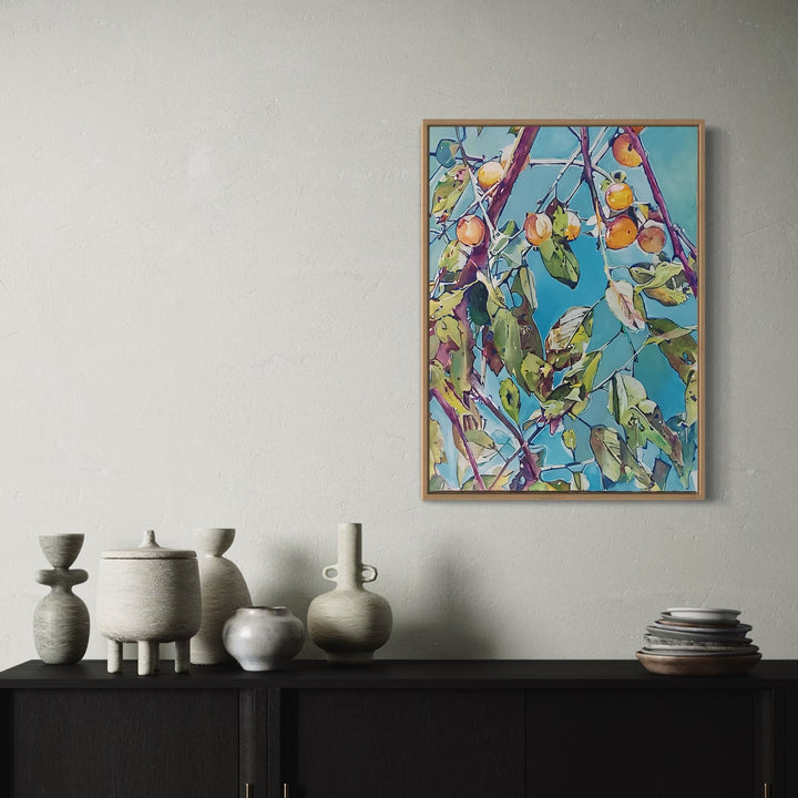 The artwork, Persimmon Tree, by Jane E. Skafte, displayed in a room.