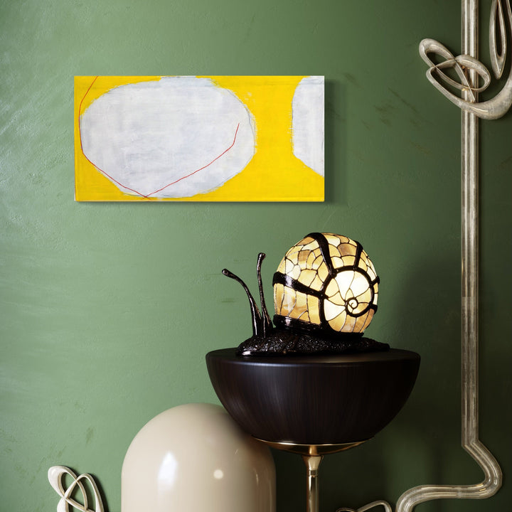 The artwork 'Red Lines on White and Yellow' by Diane Englander features a minimalist composition with a large oval white shape against a vibrant yellow background. A delicate red line curves gracefully across the white form, creating subtle contrast and movement. The mixed media piece combines papers, pencil, and acrylic on canvas in a 12x24 inch format by Diane Englander.