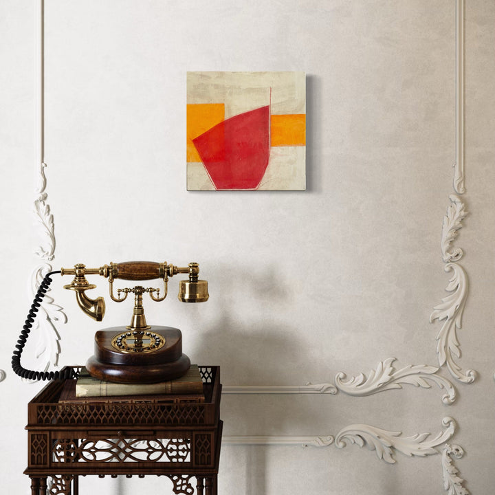 The artwork, Red, Orange and Buff IV, by Diane Englander, displayed in a room.
