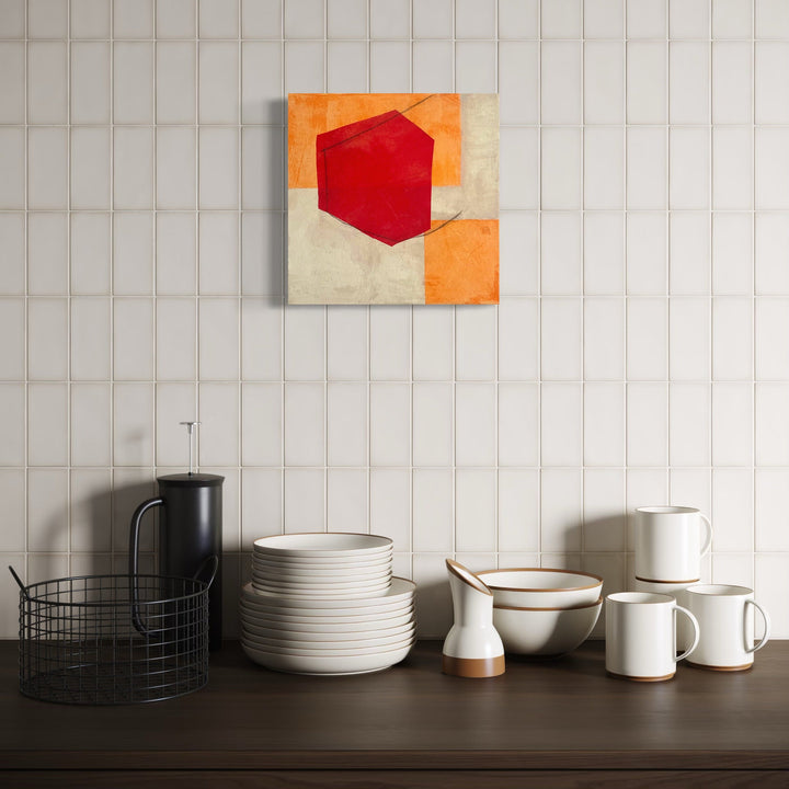 The artwork, Red, Orange and Buff VII, by Diane Englander, displayed in a room.