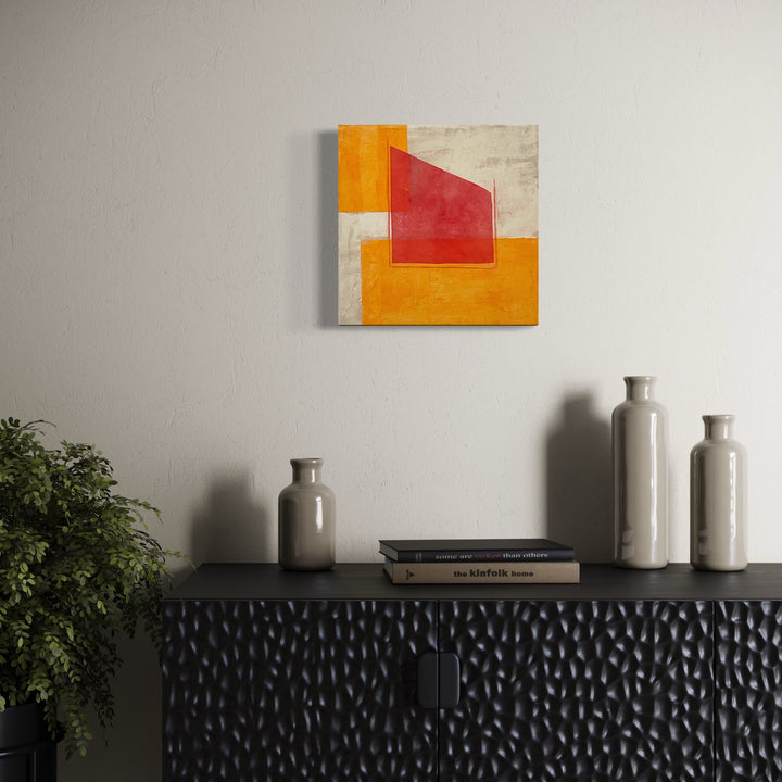 The artwork, Red, Orange and Buff V, by Diane Englander, displayed in a room.