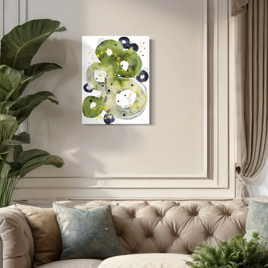 The artwork 'Rejuvenation' by Jocelyn Benford features swirling abstract forms in vibrant olive green watercolor, accented with deep navy circular elements. White negative spaces create organic shapes throughout the composition, while black speckles add texture. The fluid, contemporary mixed media piece combines loose brushwork with controlled geometric elements on white paper.
