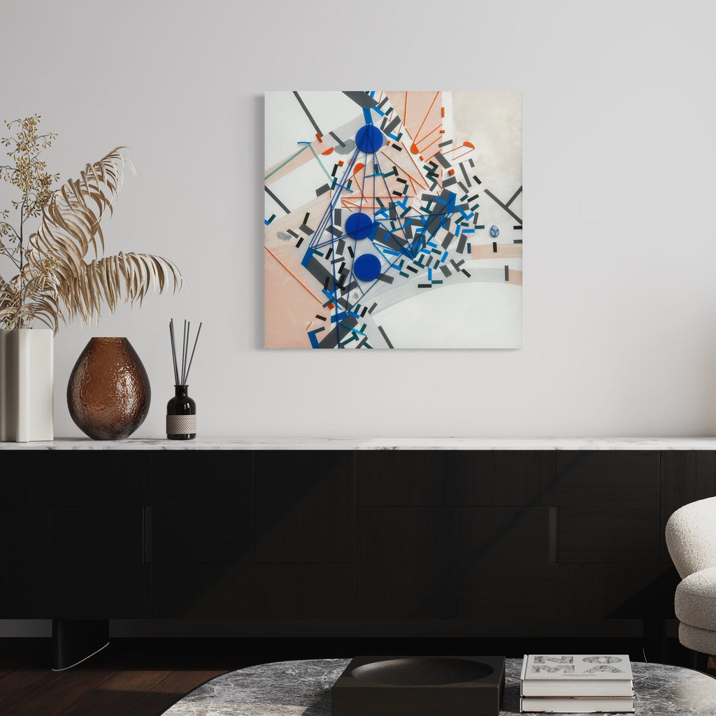The artwork 'Shatteraau' by Philippe Halaburda features a dynamic abstract composition with geometric shapes in vibrant blue and soft peach tones. Angular black lines intersect across a white background, while bold circular blue elements create focal points throughout the piece. The mixed media artwork displays a contemporary urban aesthetic with fragmented forms and asymmetrical balance. 36x36 inches by Philippe Halaburda