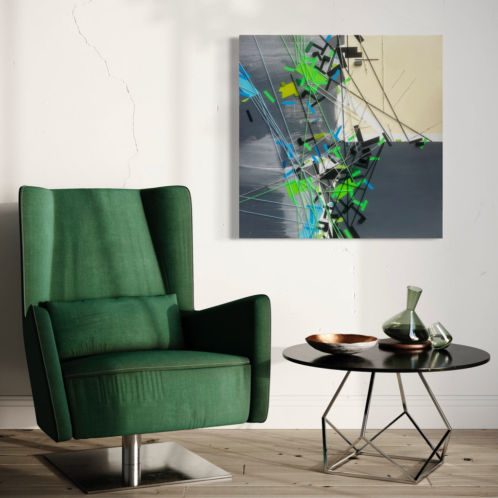 The artwork 'Slatt Gryy Khhahiic' by Philippe Halaburda features dynamic abstract composition with vibrant green and turquoise geometric shapes intersecting against a moody grey background. Bold brushstrokes and angular forms create a sense of movement, while mixed media techniques add depth and texture to this contemporary 36x36 inch piece.