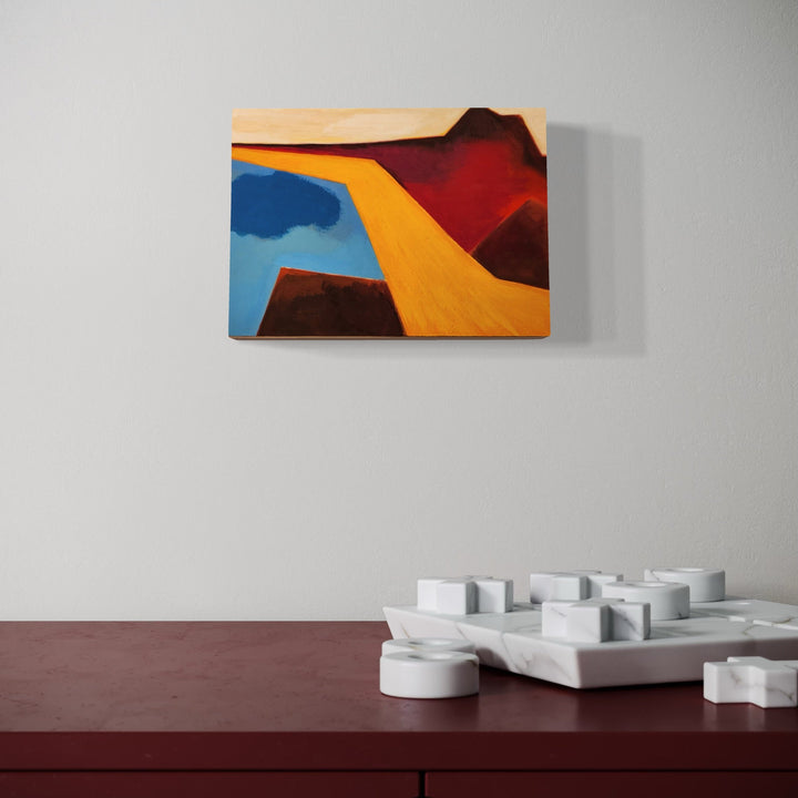 The artwork, Slide Again, by Joanie Flickinger, displayed in a room.