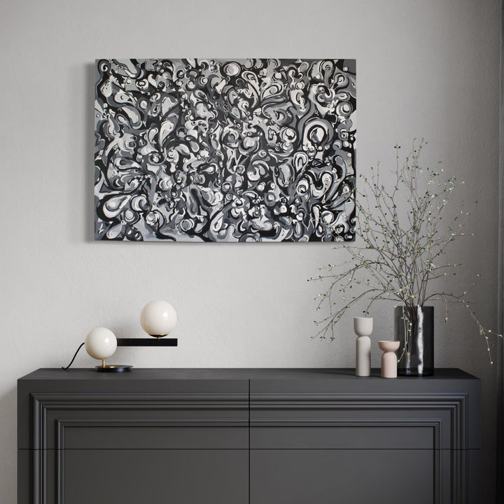 The artwork, The Absence of Color, by Kaitlin Andrews, displayed in a room.