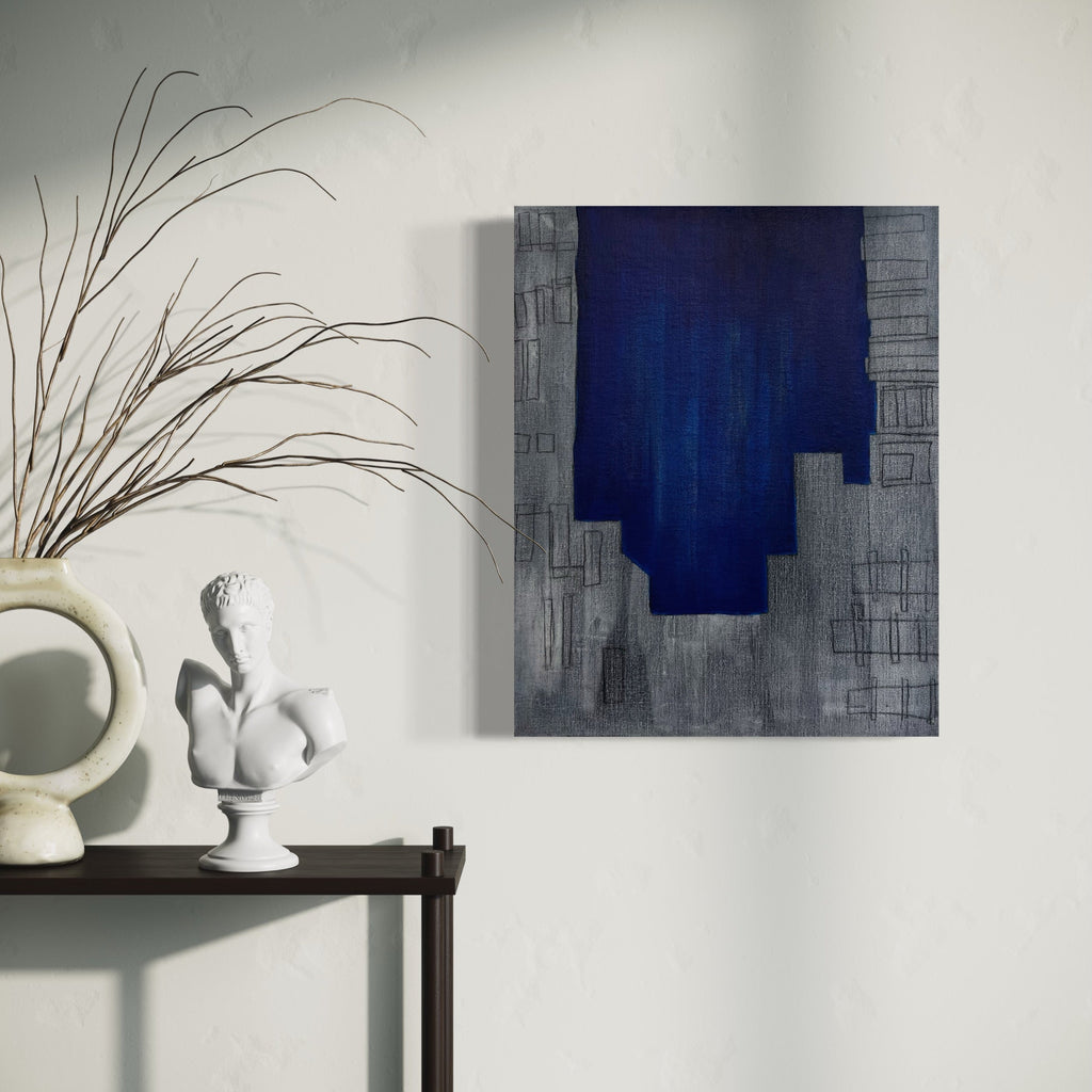 The artwork 'The Blue Hour (encroaching)' features a striking abstract composition with a deep cobalt blue vertical form against a textured gray cityscape background. Geometric patterns suggest urban architecture, while brushstrokes create subtle depth on linen canvas. Oil painting by Cora Jane Glasser.