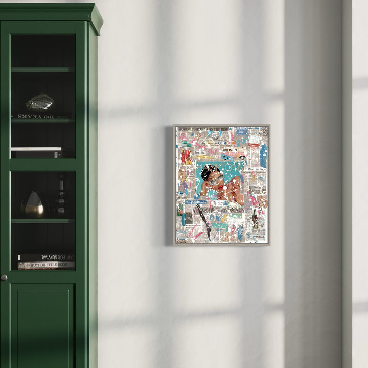 The artwork 'The Hamptoner #13' by Jean-Remi Barbier features a dynamic mixed media collage composition with vibrant turquoise, coral, and neutral tones. Abstract shapes and layered textures create a modern urban aesthetic, displayed in a floating frame against a white wall beside a dark green built-in bookshelf, showcasing contemporary acrylic artistry by Jean-Remi Barbier.