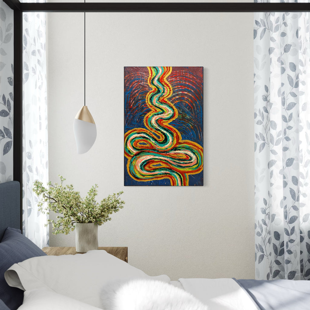 The Journey by Hillary Hany features vibrant, swirling lines in shades of green, orange, and yellow against a rich blue and reddish background, evoking a sense of movement and flow. Positioned above a minimal wooden bedside table with simple decor, it adds a dynamic, contemplative touch to a bright, softly lit bedroom space.