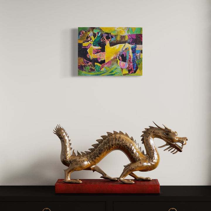 The artwork 'The Macomber Estate' by James Ehling features abstract expressionist composition with dynamic splashes of vibrant yellow, purple, and green hues. Mixed media technique combines acrylic paint and fabric on canvas, creating textural depth and movement. The 16x12 inch piece showcases bold geometric shapes and fluid brushstrokes in a contemporary abstract style.