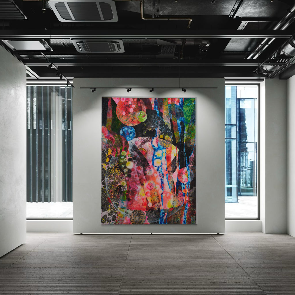 The artwork 'The Mothership' by Millie Benson features a vibrant abstract composition with explosive bursts of pink, blue, and green hues against a dark background. The large-scale mixed media piece showcases dynamic textures created through gouache, spray paint, and crayon techniques, exhibiting fluid forms and geometric patterns that interweave across the canvas.