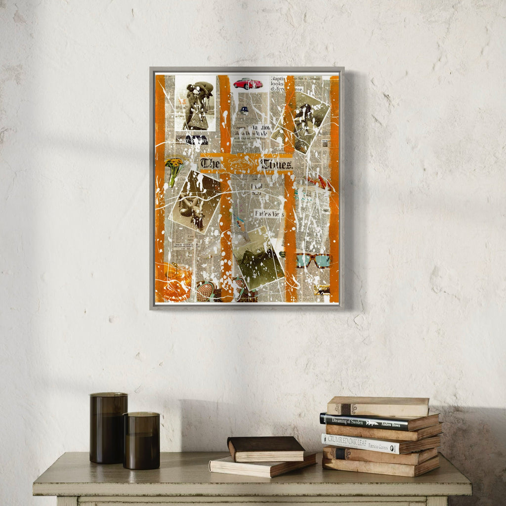The artwork 'The Sunset Times' by Jean-Remi Barbier features a striking collage composition with vertical orange streaks cutting through layers of vintage newspaper clippings and distressed paper elements. The mixed media piece combines grayscale photographs, text fragments, and abstract marks in a contemporary urban style, presented in a floating silver frame with weathered textures and spray paint accents.