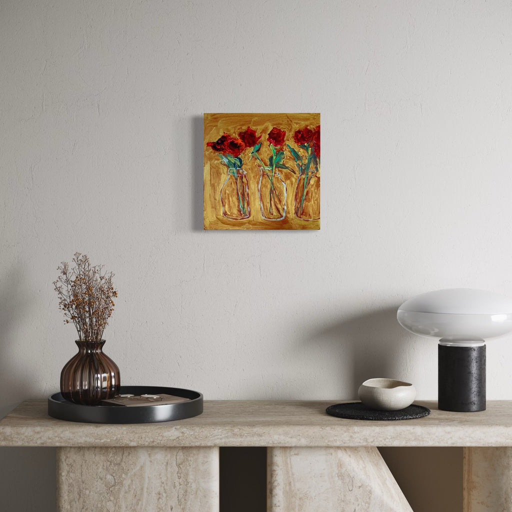 The artwork, Three roses in milk bottles, by Owen Brown, displayed in a room.