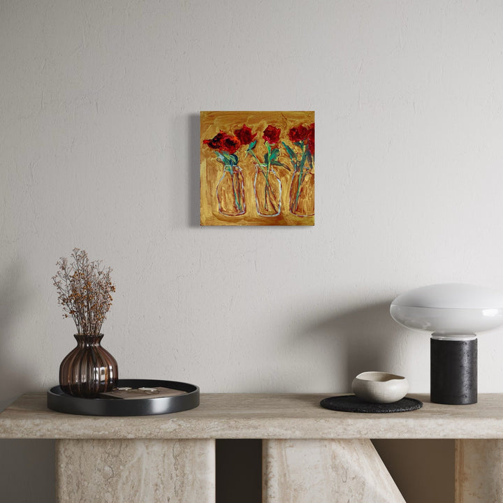 The artwork, Three roses in milk bottles, by Owen Brown, displayed in a room.