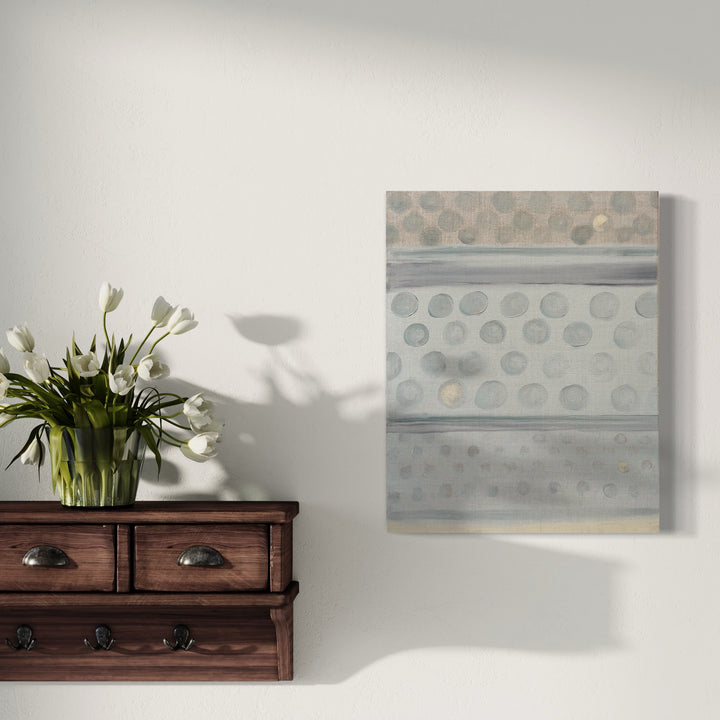 The artwork 'Vault Lights (Time Lapse-2)' by Cora Jane Glasser features a minimalist composition of repeating circular patterns in soft gray and muted sage tones. The oil painting on linen canvas presents horizontal bands with precise geometric dots, creating a tranquil rhythm across the surface, suggesting architectural elements in an abstract modern style.