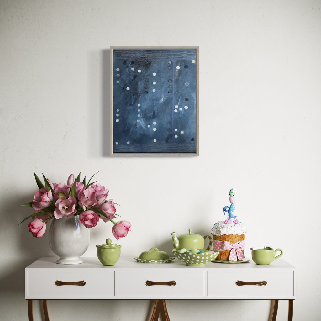 The artwork 'Vault Lights (Time Lapse-3)' by Cora Jane Glasser features a mesmerizing abstract composition with scattered white circular dots against a deep blue-grey atmospheric background. The oil painting on stretched linen creates a celestial, night sky effect, with varying tones and textures suggesting depth and movement across the canvas.