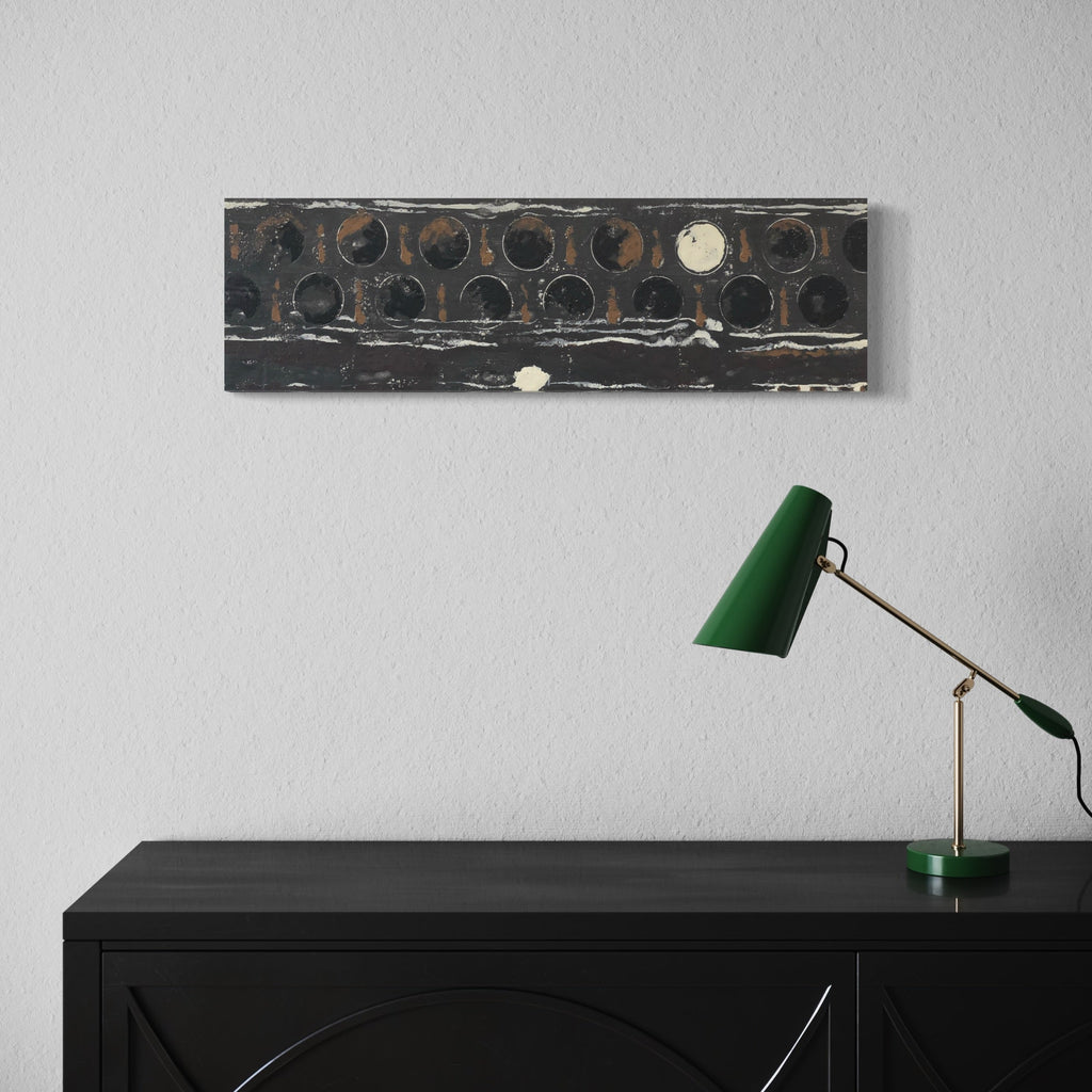 The artwork 'Vault Lights (Treads & Risers-2)' by Cora Jane Glasser features a horizontal composition of circular patterns in dark tones, reminiscent of industrial vault lights. The encaustic and oil painting on birch panel showcases a series of weathered black circles with rusty undertones, creating a textural, architectural study that evokes historic sidewalk prism lights.