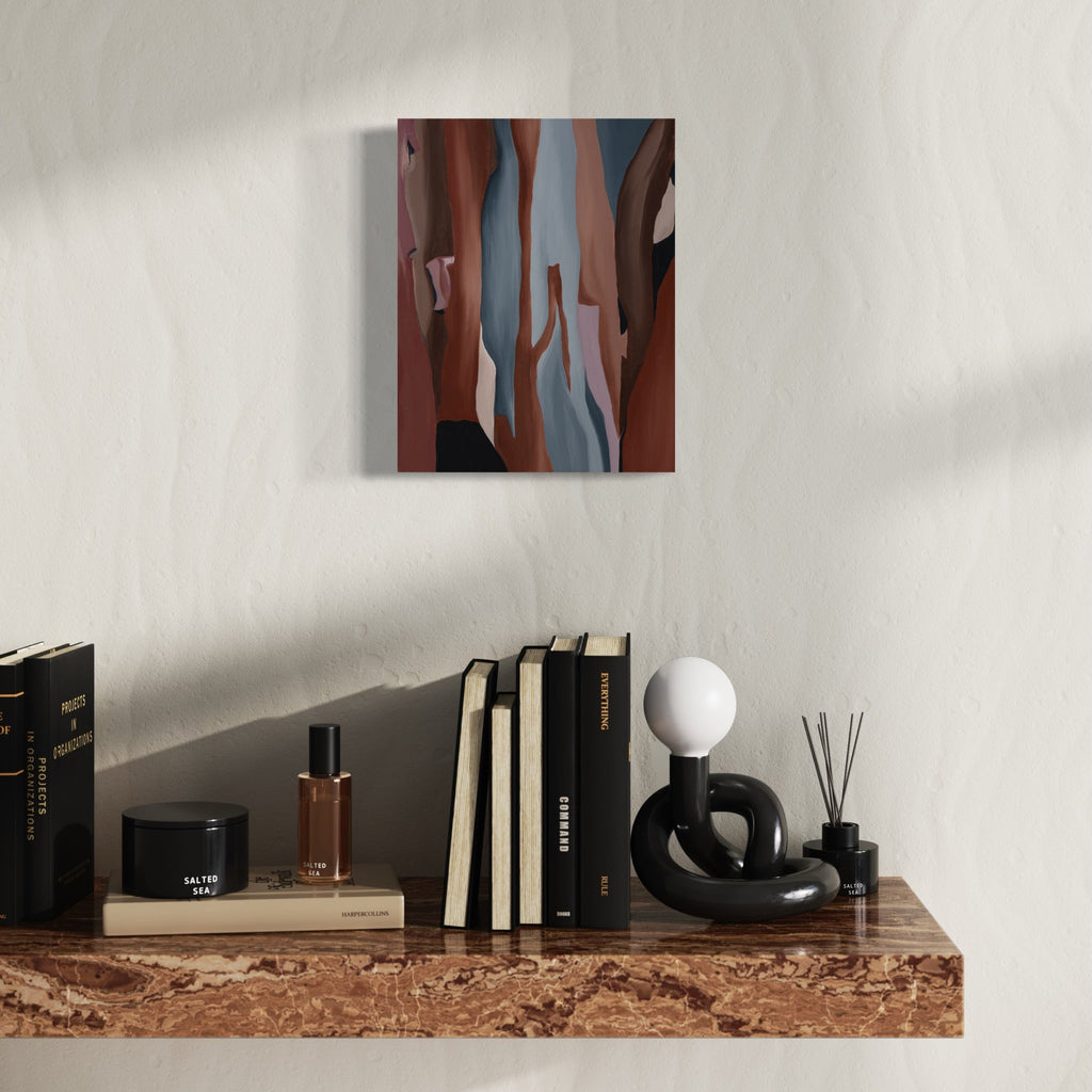 A photo of the artwork Veiled Metamorphosis, by Taylor Stoneman, hanging on a wall.