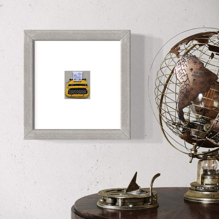 A photo of the artwork Vintage Typewriter (Smith Corona Sterling), by Ann Cofta, hanging on a wall.