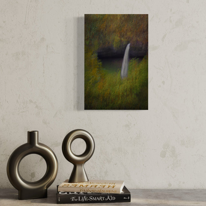 The artwork 'Waterfall in Oregon' by Neil Shapiro captures a serene waterfall cascading down dark rocky cliffs, surrounded by impressionistic autumn foliage in gold and green hues. The artistic print features a dreamy, soft-focus technique that creates an ethereal atmosphere, rendered on textured Hahnemuhle paper, showcasing the natural beauty of the Pacific Northwest landscape. By Neil Shapiro.