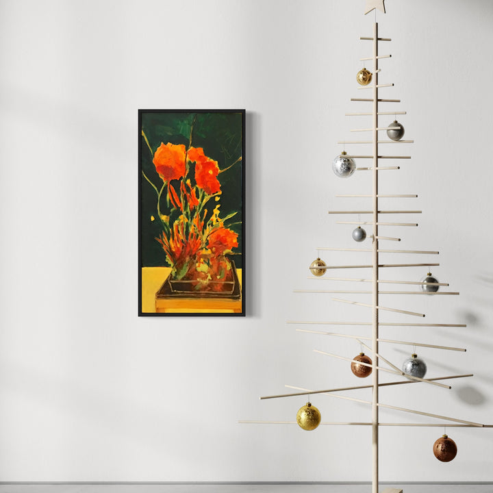 The artwork 'every song of this country has an unsung third stanza' by Owen Brown features vibrant orange tulips arranged in a modern vase against a deep emerald green background. The flowers are painted in bold acrylic strokes, creating a striking contrast with the yellow base, displayed in a black frame measuring 32x16 inches on canvas.