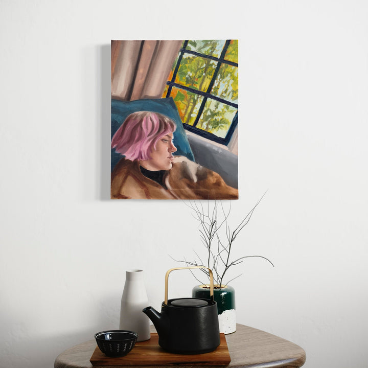 The artwork 'Haircut' by Jillian Shea depicts a contemplative figure with pink hair resting against a blue cushion, set against a window backdrop with autumn yellow foliage. The oil painting features warm earth tones, soft brushstrokes, and natural light streaming through windowpanes, creating a serene indoor scene at 20x16 inches by Jillian Shea.