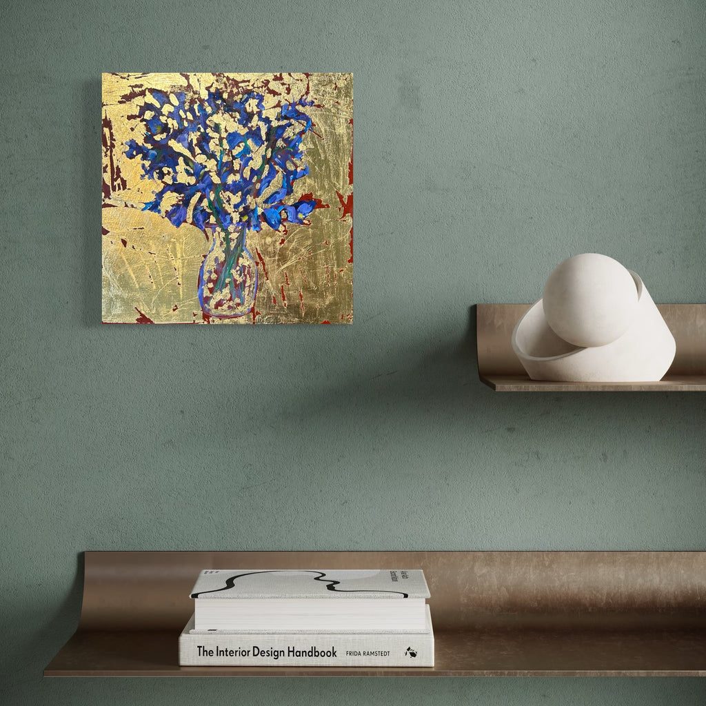 The artwork, Irises in glass vase, by Owen Brown, displayed in a room.