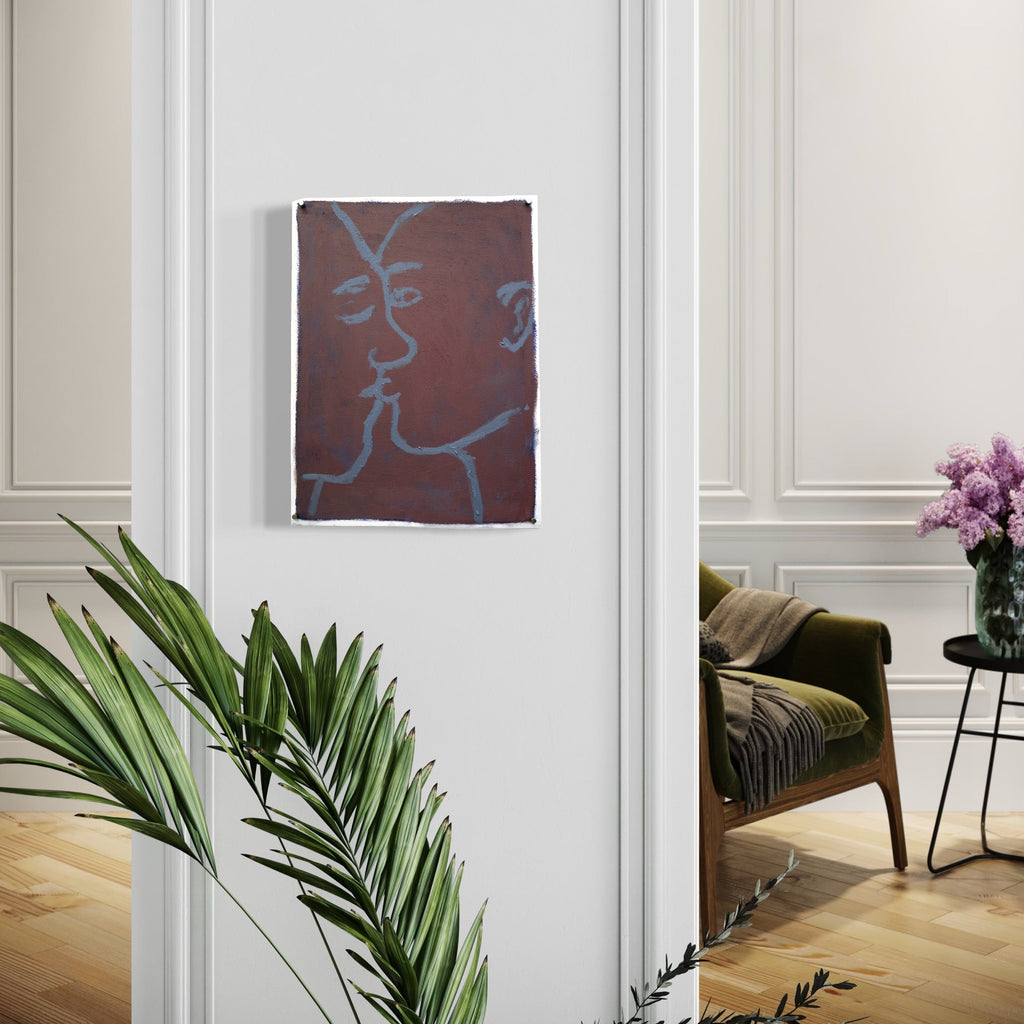 The artwork, movie kiss, by Chelsie Sunde, displayed in a room.