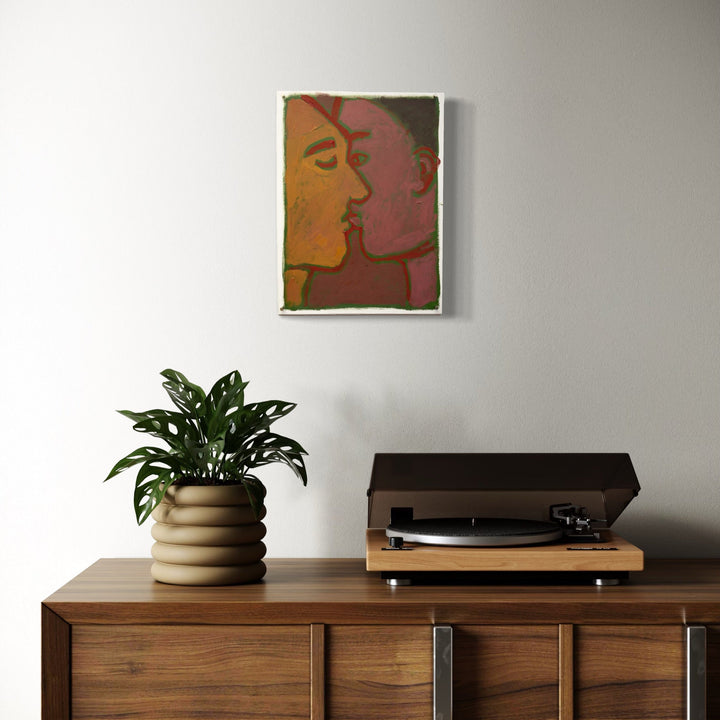 The artwork, movie kiss II, by Chelsie Sunde, displayed in a room.